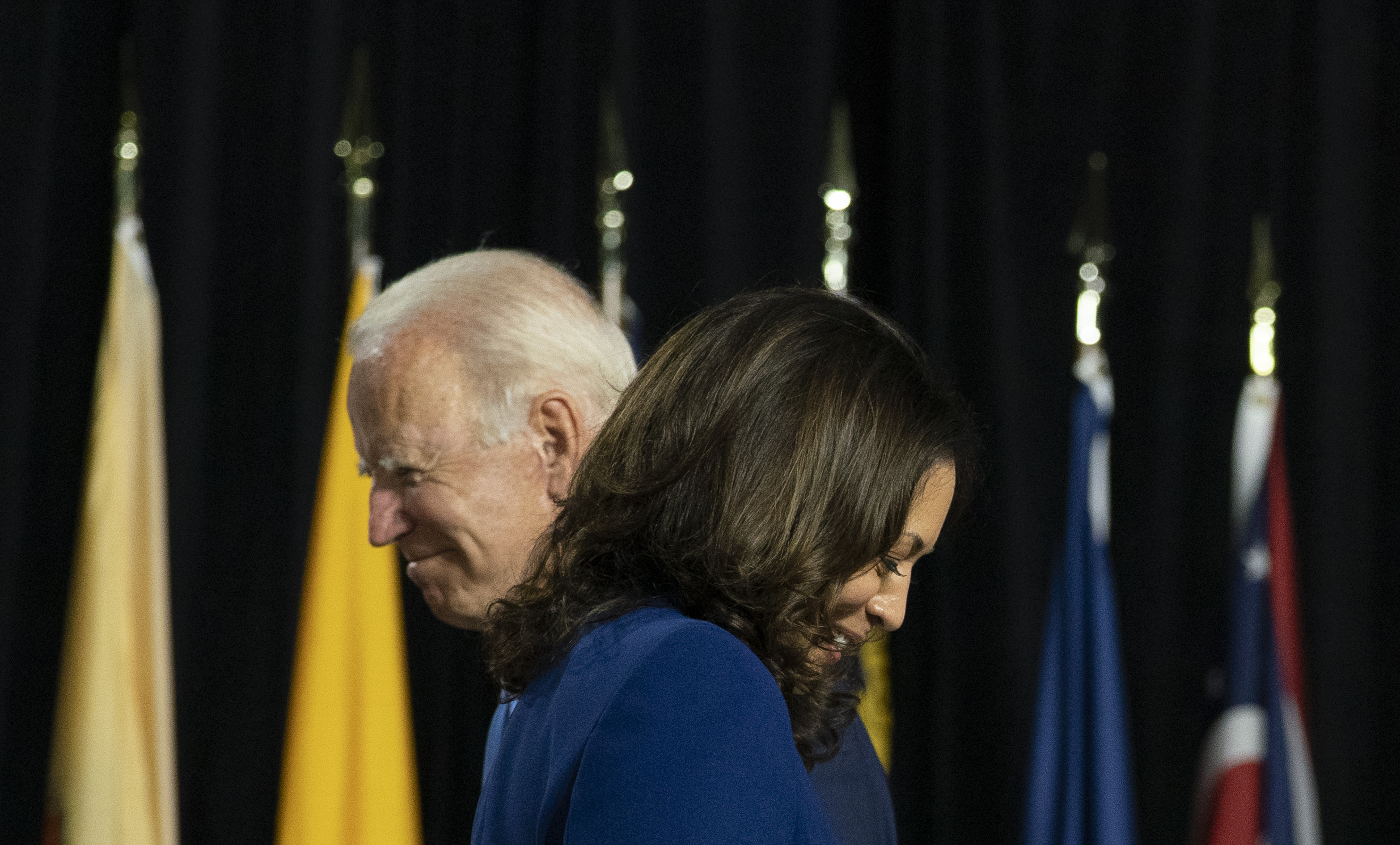 During a campaign event in the last election cycle, Joe Biden and Kamala Harris pass each other on stage at Alexis Dupont High School in Wilmington, Del., Wednesday, Aug. 12, 2020.