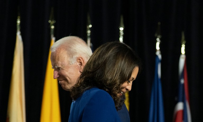 During a campaign event in the last election cycle, Joe Biden and Kamala Harris pass each other on stage at Alexis Dupont High School in Wilmington, Del., Wednesday, Aug. 12, 2020.