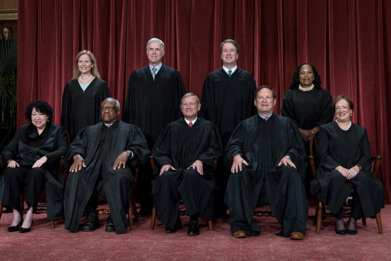 Members of the Supreme Court sit for a group portrait at the Supreme Court building in Washington, Oct. 7, 2022.