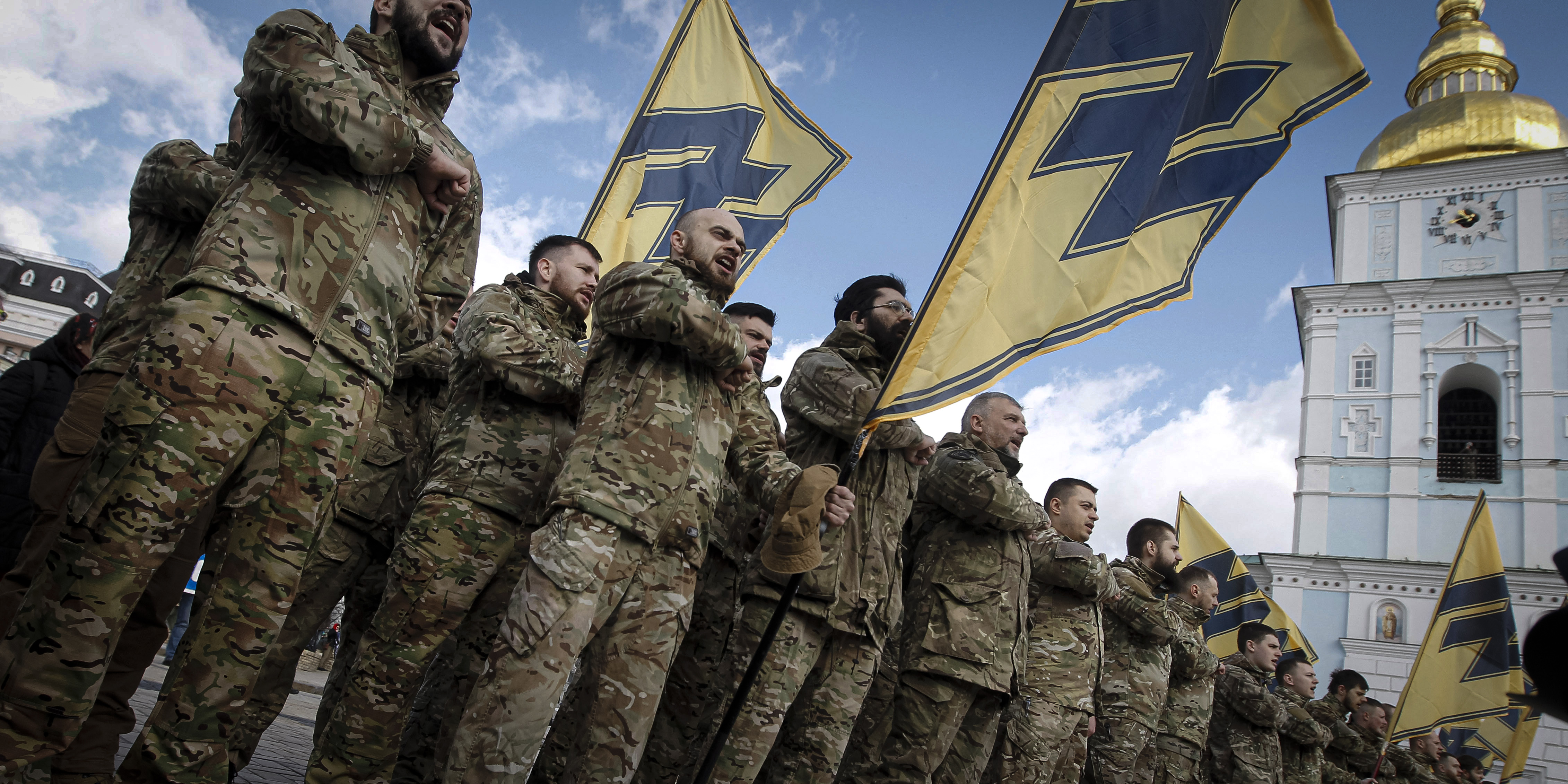 Ukrainian veterans of the 'Azov' volunteer battalion attend a rally dedicated to the Volunteer Day in honor of volonteer fighters who joined Ukrainian Army at a war conflict at eastern the country regions, in downtown of Kyiv, Ukraine, on 14 March, 2020. Several thousands Ukrainians including servicemen, volunteers and their supporters marched in central of Ukrainian capital despite the ban on holding mass events because of the COVID-19 coronavirus. On 11 March 2020 the Ukrainian Government has approved measures in the face of a threat of coronavirus infection outbreak in Ukraine and to prevent the spread of COVID-19 coronavirus. The quarantine in educational institutions for a period of three weeks introduced in Ukraine from March 12, and to impose restrictions on conducting mass events in which 200 or more people are planned to participate. (Photo by STR/NurPhoto via Getty Images)