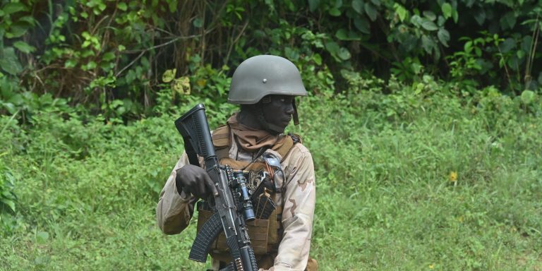 A Nigerien soldier looks on as he takes part in the Flintlock 2023 military training hosted by the International Counter-Terrorism Academy, in Jacqueville, Ivory Coast, on March 11, 2023. (Photo by Issouf SANOGO / AFP) (Photo by ISSOUF SANOGO/AFP via Getty Images)