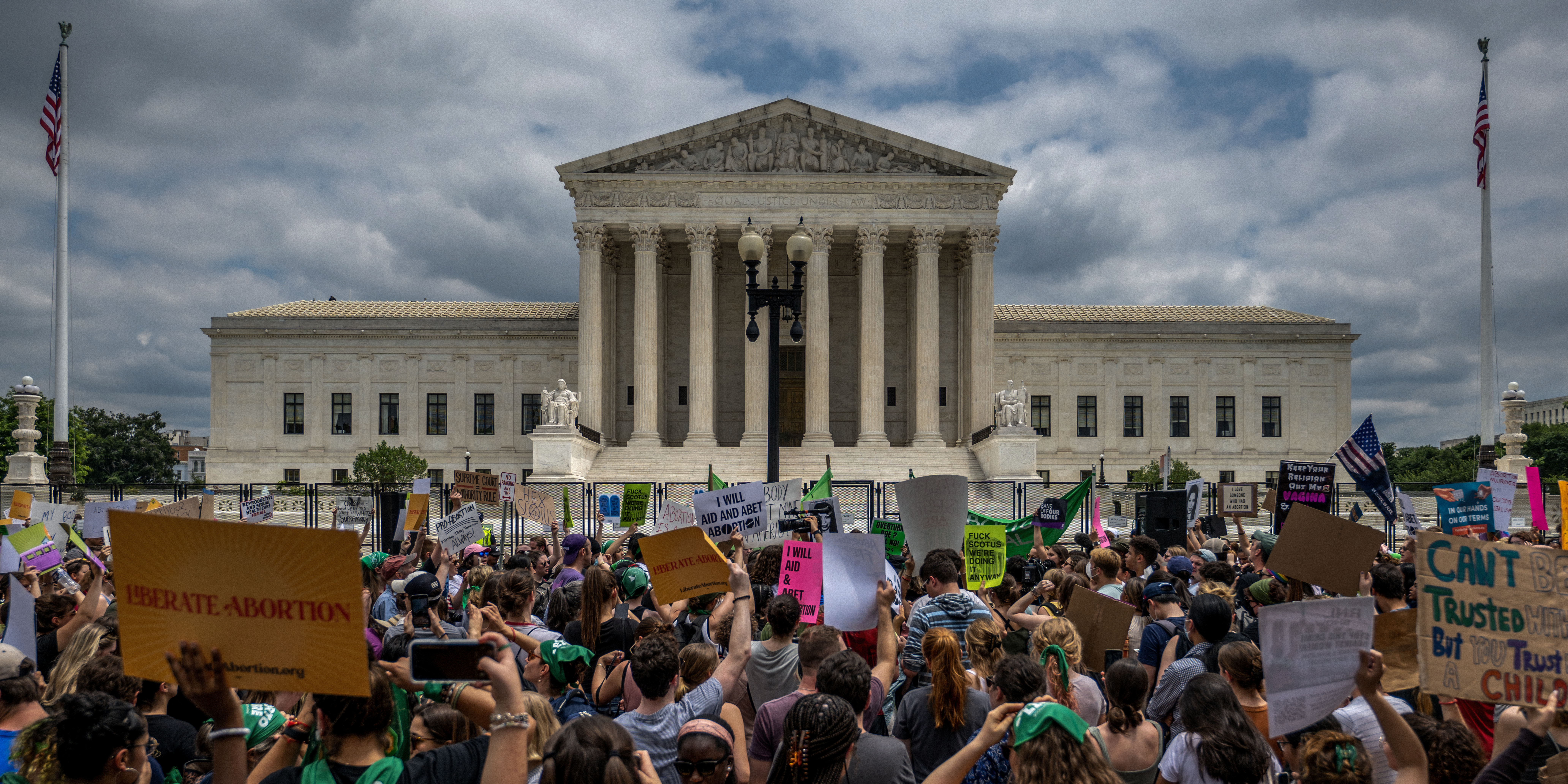 WASHINGTON, DC - JUNE 24: People protest in response to the Dobbs v Jackson Women's Health Organization ruling in front of the U.S. Supreme Court on June 24, 2022 in Washington, DC. The Court's decision in Dobbs v Jackson Women's Health overturns the landmark 50-year-old Roe v Wade case and erases a federal right to an abortion. (Photo by Brandon Bell/Getty Images)