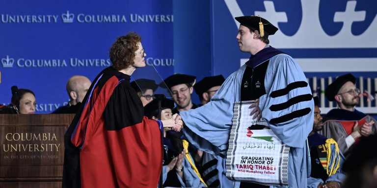 NEW YORK, UNITED STATES - MAY 13: Alumni of Columbia law school carry out silent pro-Palestinian protest with keffiyehs and banners, calling for ceasefire during their graduation ceremony in New York, United States on May 13, 2024. (Photo by Fatih Akta/Anadolu via Getty Images)