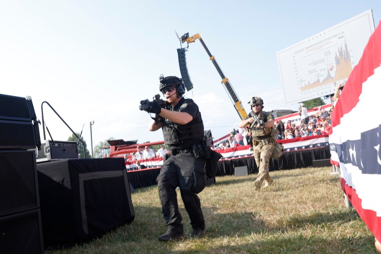 Law enforcement officers react at the rally where former President Donald Trump was injured in a shooting on July 13, 2024 in Butler, Pennsylvania.