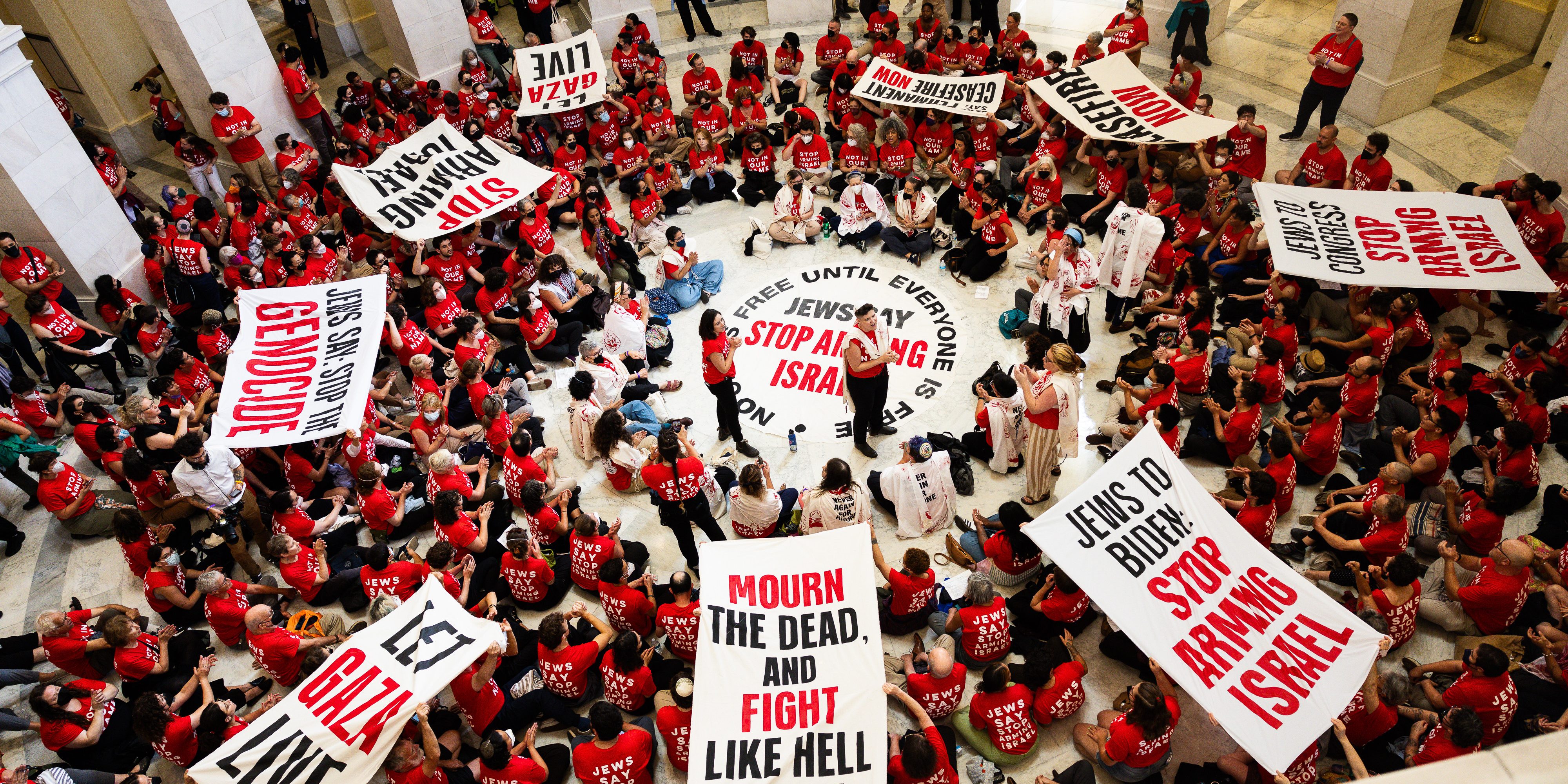 WASHINGTON, DC - JULY 23: Demonstrators from Jewish Voice For Peace protest the war in Gaza at the Canon House Building on July 23, 2024 in Washington, DC. The protest comes a day before Israeli Prime Minister Benjamin Netanyahu is set to speak before Congress. (Photo by Tierney L. Cross/Getty Images)