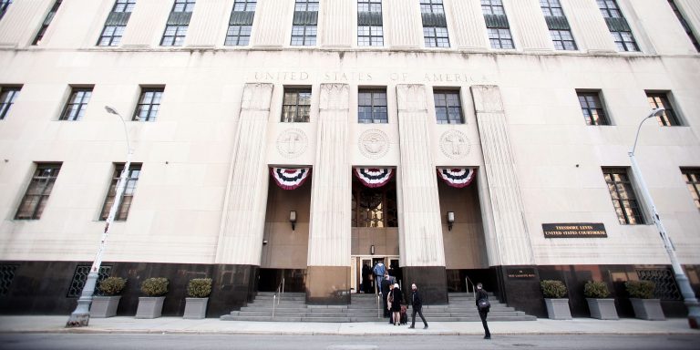 DETROIT, MI - APRIL 17:  People enter the U.S. Courthouse where a hearing in the City of Detroit's bankruptcy case is being held April 17, 2014 in Detroit, Michigan. Today, U.S. Bankruptcy Judge Steven Rhodes will decide whether Detroit Emergency Manager Kevyn Orr's newest bankruptcy reorganization plan is ready for creditors to vote to accept or reject it. (Photo by Bill Pugliano/Getty Images)