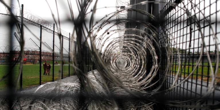 In this Tuesday, April 13, 2010 photo, razor wire is positioned in the fence area at the state prison in Camp Hill, Pa. The Pennsylvania Department of Corrections is evaluating whether it needs to have officers constantly on tower duty, since security has been enhanced and only five of 27 state facilities even have towers due to changes in prison design. (AP Photo/Carolyn Kaster)